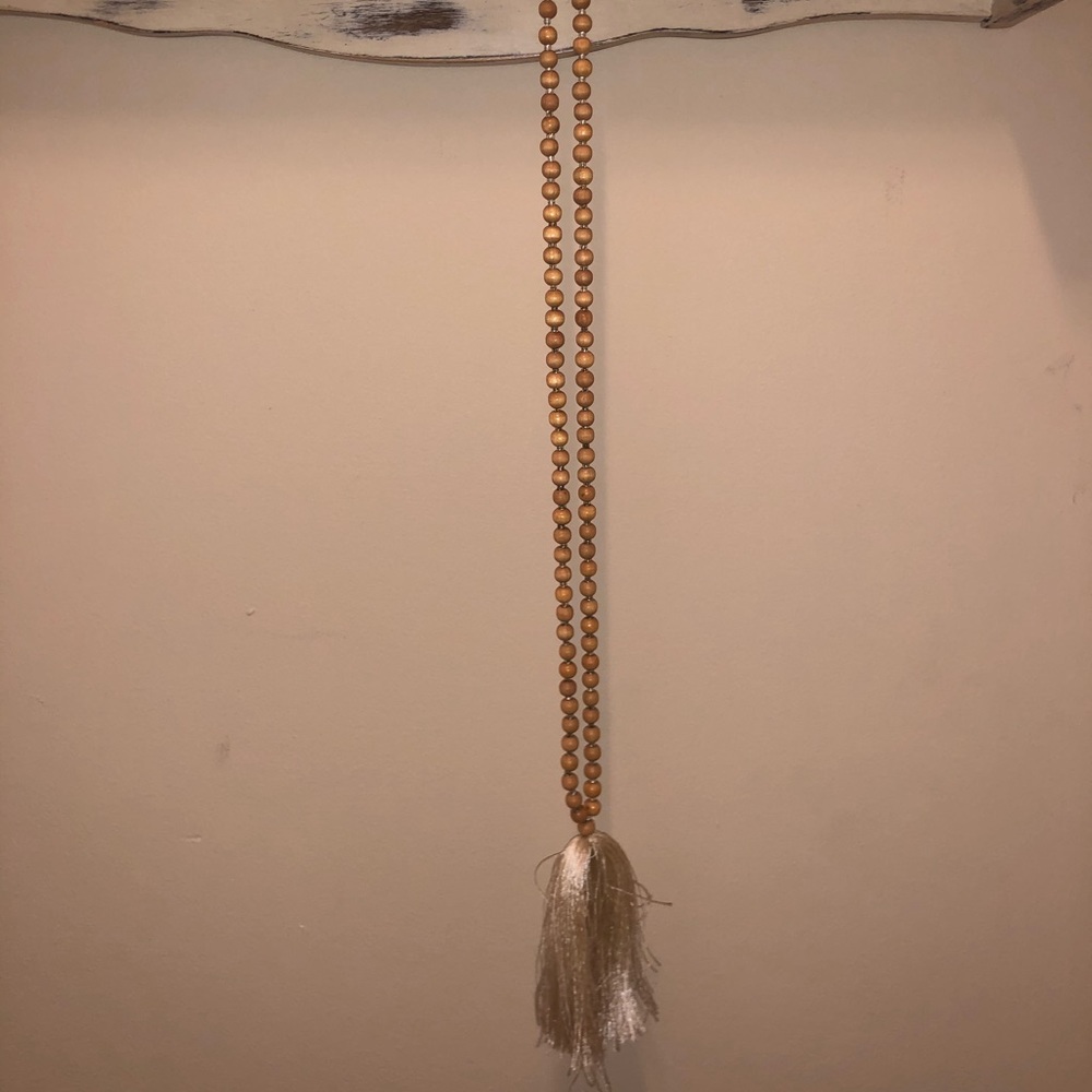Long beaded necklace with cream fringe